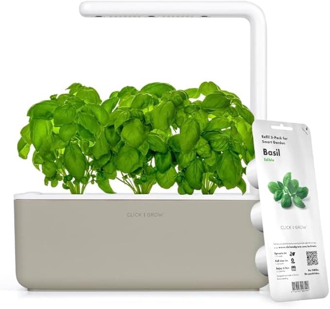 Click and Grow beige smart garden with basil plants sprouting